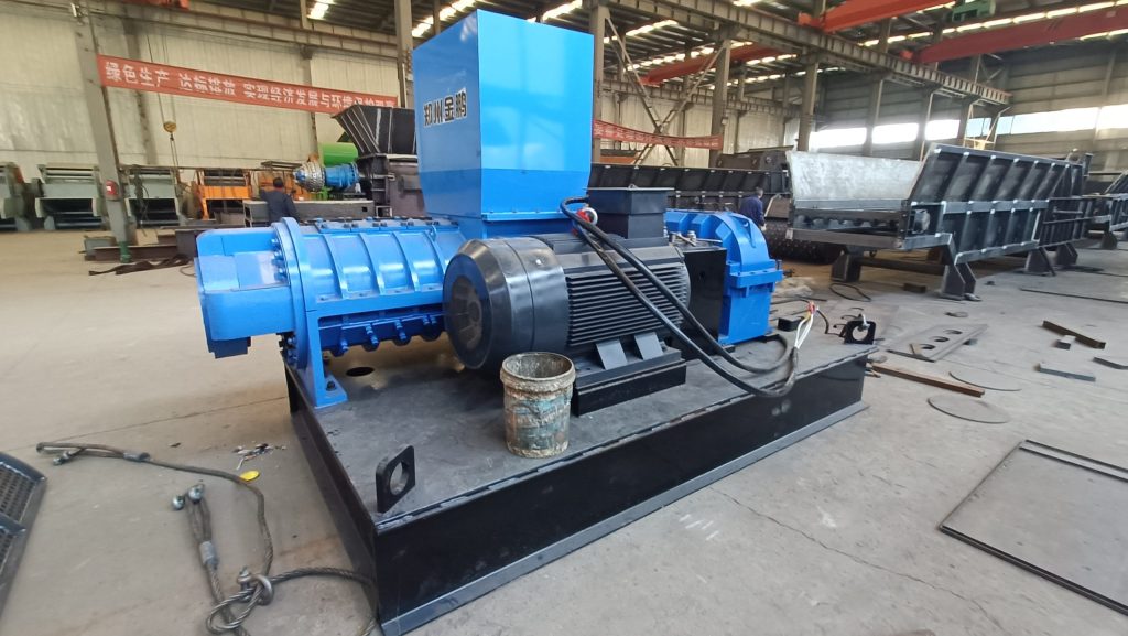 High-torque industrial screw crusher for biomass waste processing at a recycling plant